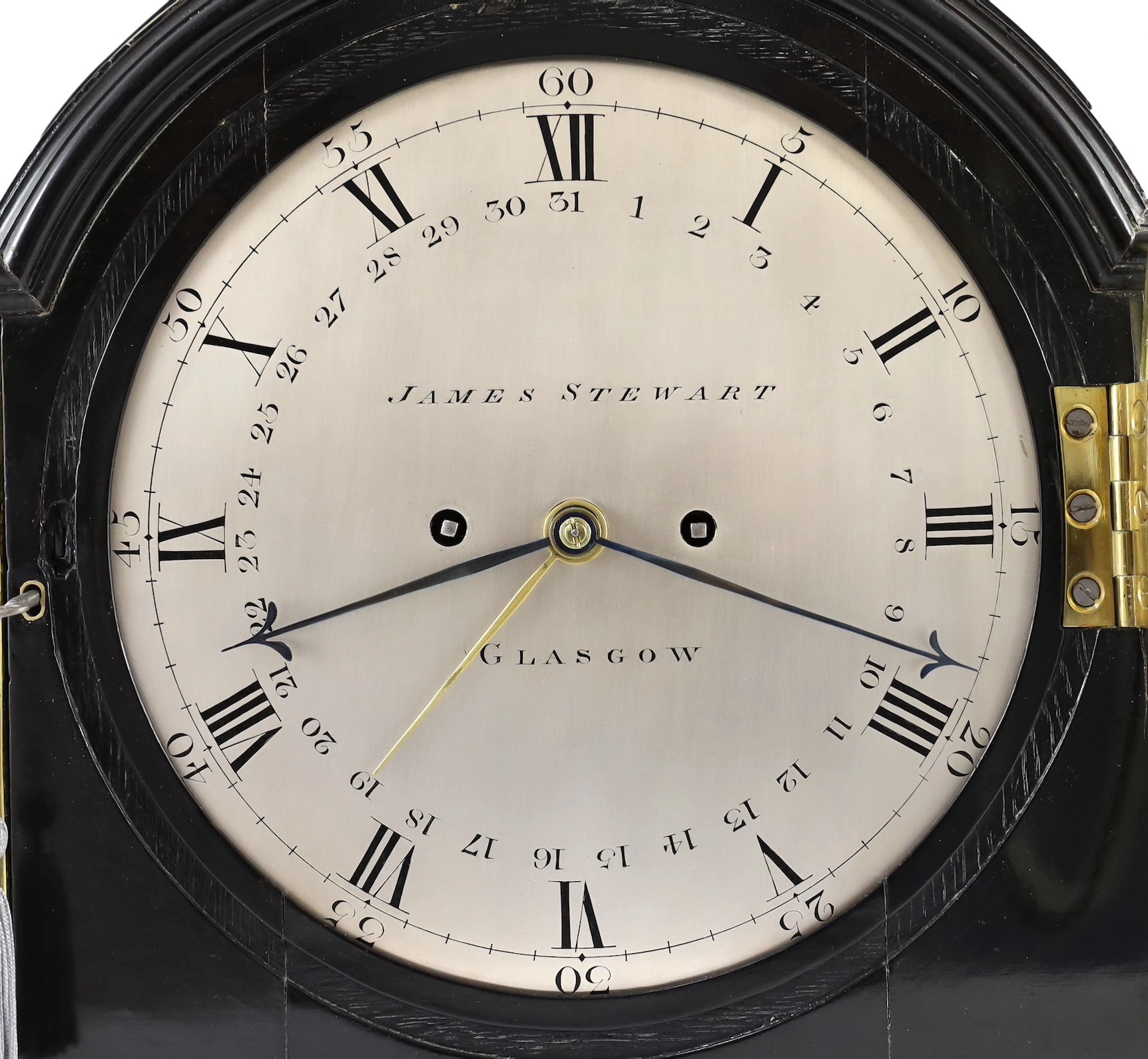 James Stewart of Glasgow. A Regency brass mounted ebonised bracket clock, 34cm wide 38cm high